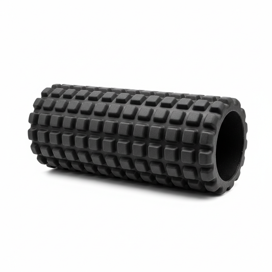 High-density black textured foam roller for muscle recovery on white background